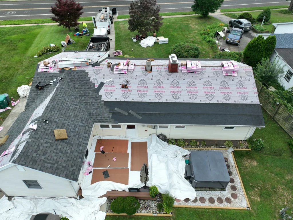 Architectural shingles being installed during a roof replacement in Fairless Hills, PA.