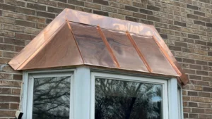 Custom copper bay window roof installed by DaVinci Roofing Corp in Yardley, PA.