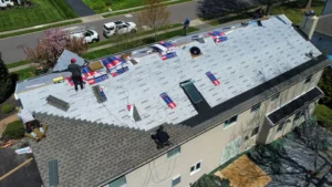 DaVinci Roofing crew installing roof underlayment during a roof replacement in Yardley, PA.