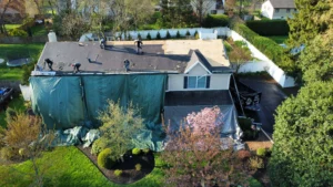 Roof tear-off in progress during a residential roof replacement in Yardley, PA.
